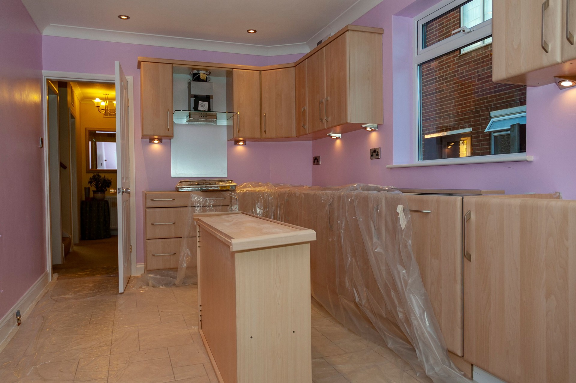 New fitted kitchen in a domestic kitchen nears completion after restoration work.